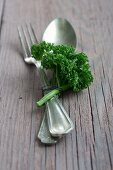 Cutlery decorated with a sprig of parsley
