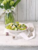 Easter salad with cucumbers, radishes and egg