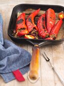 Stuffed, grilled chillis in a gill pan