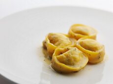 Tortellini with a butter sauce and herbs