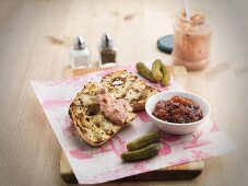 Pate on toasted bread, gherkins and relish