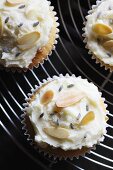 Cupcakes decorated with slivered almonds and dried lavender flowers