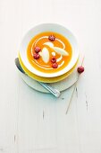 Apricot soup with semolina dumplings and raspberries