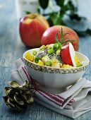 Herring salad with apple, egg and spring onions