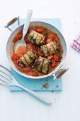 Aubergine parcels on a bed of tomatoes