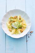 Monk fish fillet wrapped in courgette on a bed of mussels and shell pasta