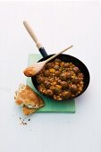 Baked beans with meat balls and unleavened bread