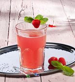 A glass of raspberry lemonade with ginger