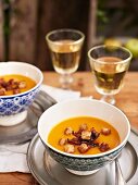 Apple and pumpkin soup with bacon and croutons