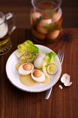 Pickled eggs with lettuce and onions