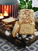 Rustic wholemeal bread on a wooden board for Christmas