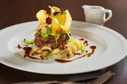 Beef fillet with potato crisps and mushrooms