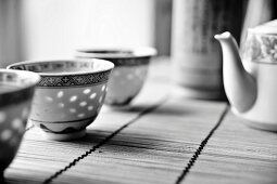 Chinese tea crockery on a bamboo mat (black and white image)