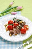 Saddle of lamb with tomatoes, garlic and rosemary