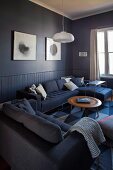 Comfortable sofa combination and classic coffee table in blue lounge area