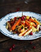 Marinated roasted root vegetables with pistachios and lingonberries