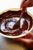 Chocolate glaze being stirred