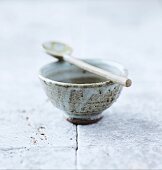 A traditional Japanese ceramic tea bowl and spoon