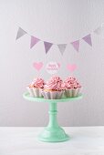 Cupcakes with pink buttercream and bunting for a birthday party