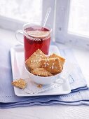 Biscuits with sugar crystals served with a cup of tea