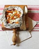 Carrots with taragon and goat's cheese in aluminium foil