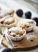 Plum and poppyseed crumble cake with icing sugar