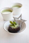 Chocolate cake filled with matcha tea cream for Christmas