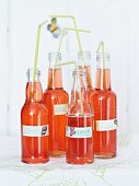 Bottles of homemade strawberry and rosewater lemonade