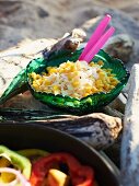 White cabbage salad with sweetcorn for a Caribbean picnic on a beach