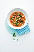 Bean stew with tomatoes and cocktail sausages