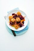 Sesame seed dumplings with apple red cabbage