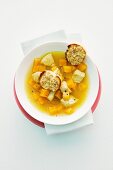 Pumpkin soup with chicken and baguette