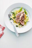 Poached lamb shoulder with vinaigrette and spring onions