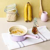 Sweet oat soup with bananas and maple syrup