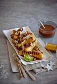 Grilled lady finger banana with a chocolate and caramel sauce