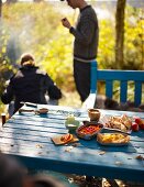 An autumnal picnic in a garden