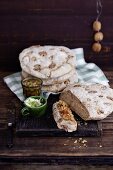 A stack of walnut bread with spreads