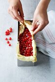 Redcurrant terrine being made: crepes being folded over fruit