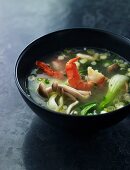Asian soup with mushrooms, bok choy and prawns