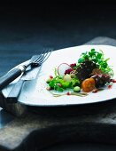 A small salad with rye bread