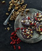 Chocolate disks with dried goji berries, mulberries and nuts