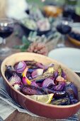 Aubergines with lemons and red onions