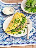 Omelette with peas, mange tout, ham and Pecorino