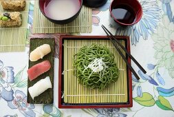 Various types of sushi with wasabi noodles