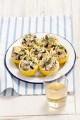Lemons filled with cod and olives