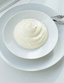 Mascarpone cream on a white plate