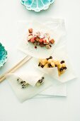 Three sheets of rice paper with various sweet fillings for spring rolls
