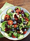 Lamb's lettuce with cherry tomatoes, cucumber, blueberries and a sweet blueberry and balsamic vinegar dressing