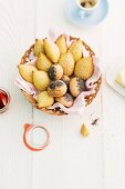 Sesame seed rolls and poppy seed rolls in a bread basket