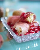 Ham rolls with egg cream and pomegranate seeds for breakfast